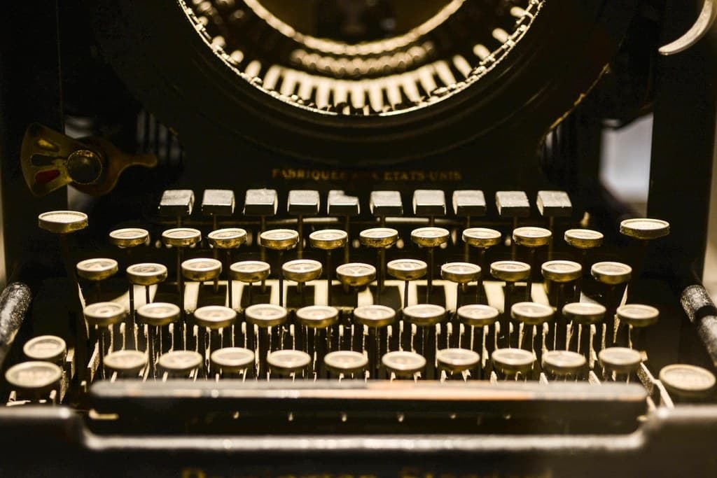 A close-up of the keys and mechanism of an old typewriter