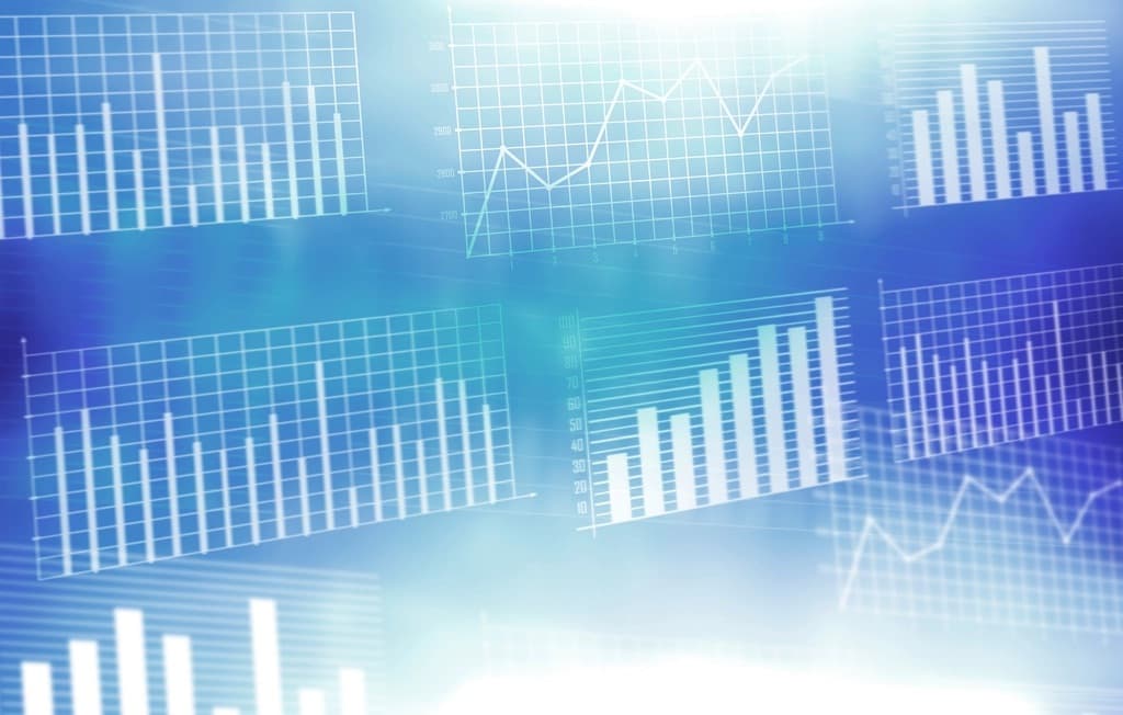 An abstract collage of blue-toned performance charts and bar graphs